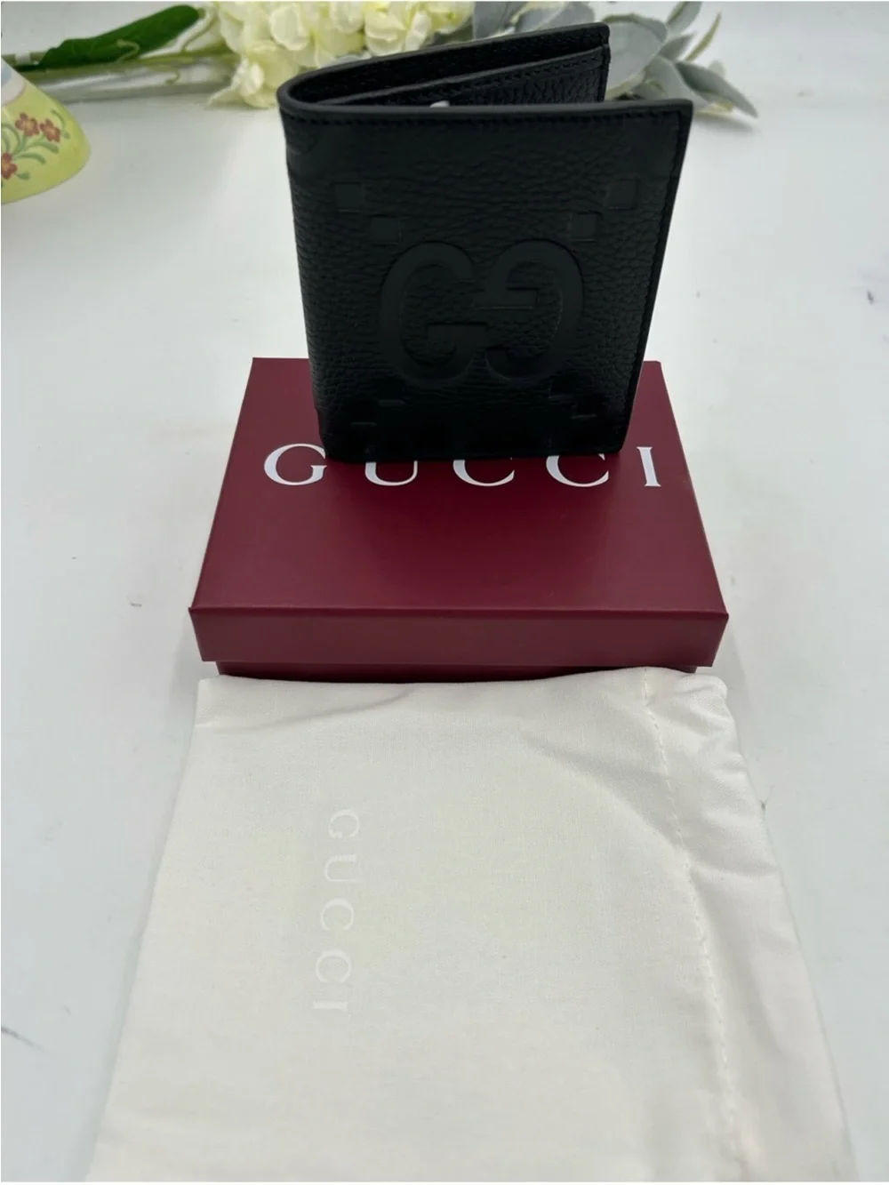 Men’s Gucci, jumbo GG leather bifold wallet made in Italy